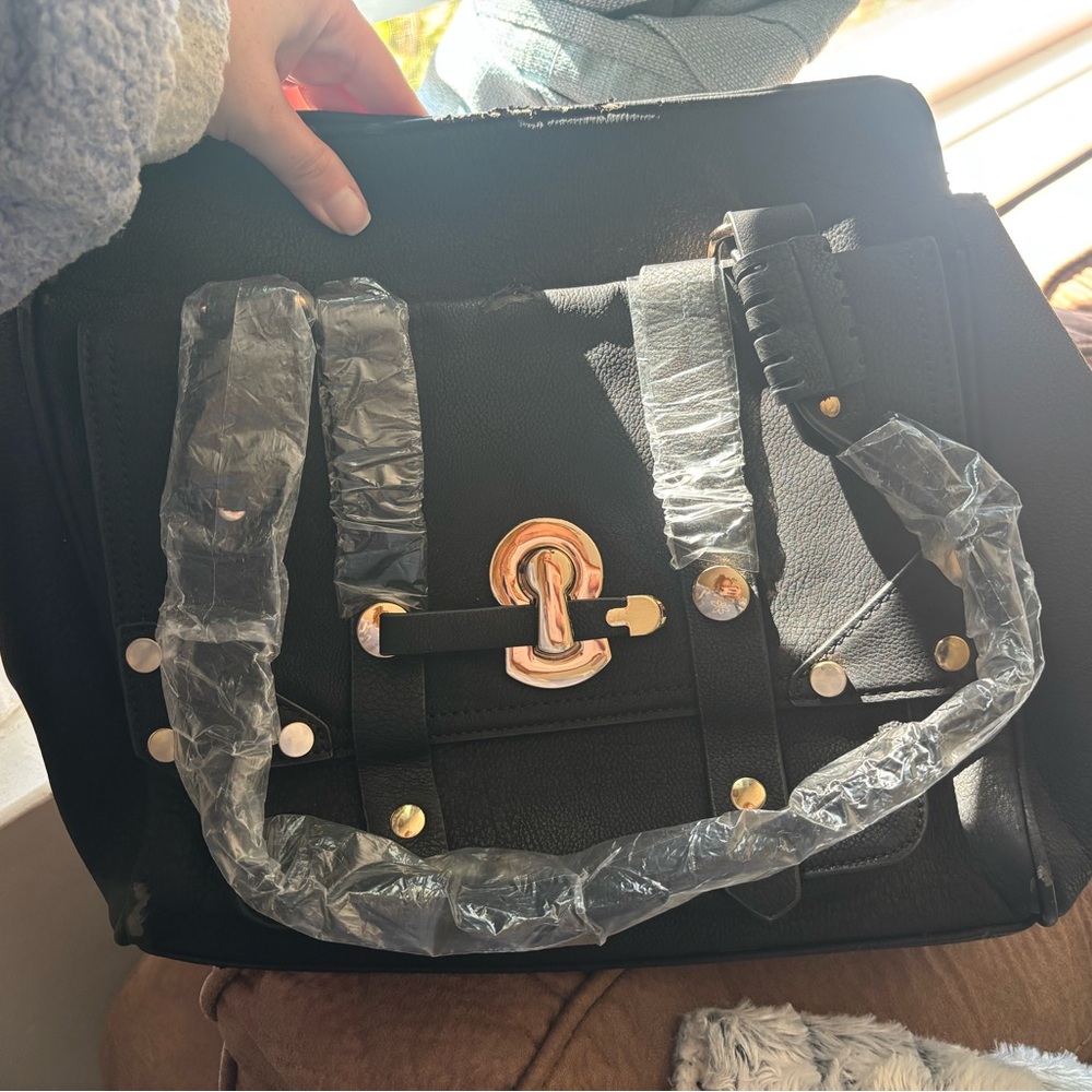 Elegant Black Satchel with Gold Details